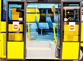 Modern city bus entrance with open doors