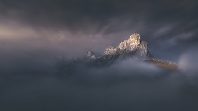Fototapeta High mountain pass in dramatic misty mood