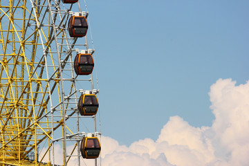 Ferris wheel cabins on blue sky background at Mtatsminda Park in Tbilisi, Georgia