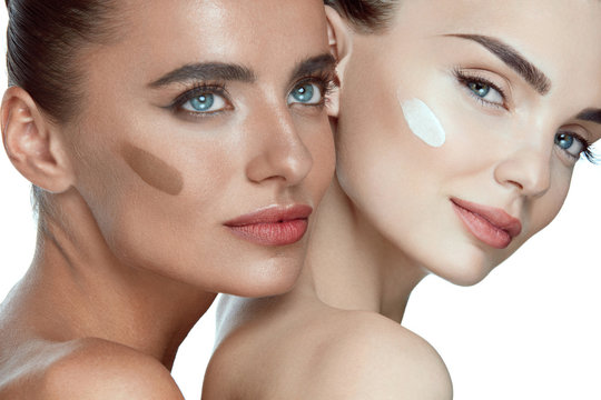 Face Cosmetics. Sexy Models With Foundation On Skin