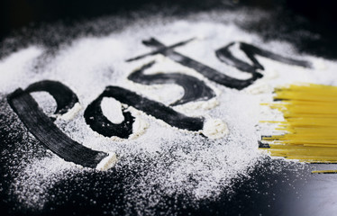 The inscription on the flour. Paste. Black background