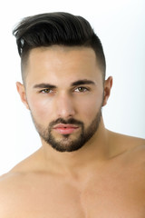 Obraz premium Young fit man showing muscular torso