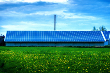 Solar Panels Against The Deep Blue Sky And Clouds