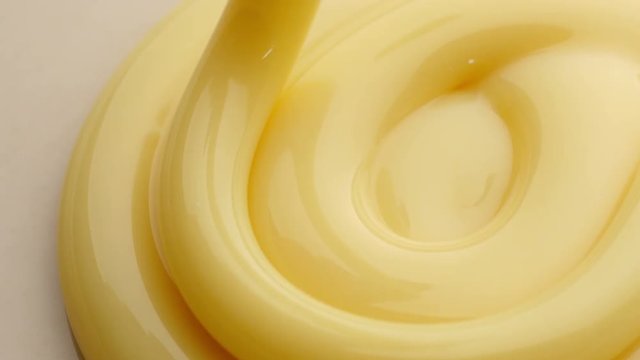 Pouring sweetened condensed milk. Close-up shot.