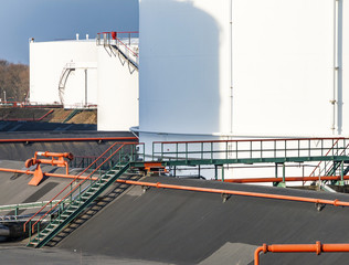 white tanks in tank farm w
