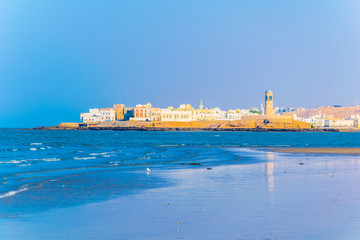 View of the Al Ayjah town from a beach in Sur, Oman. © dudlajzov