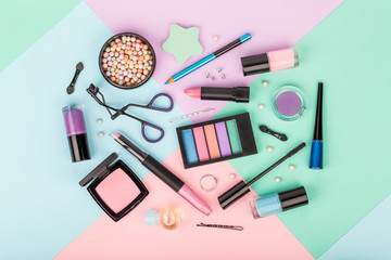 set of professional decorative cosmetics, makeup tools and accessory on multicolored background....