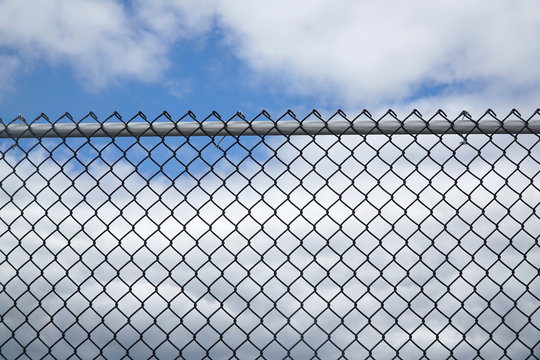 Iron Chain Link Fence Against Sky