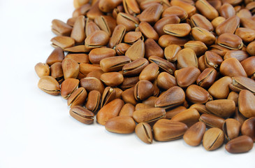 fresh pine nuts isolated on white background