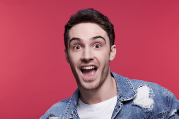 close up portrait of young handsome casual man looking at camera, attractive young man