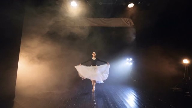 The ballerina flying around, standing on the pointe shoes. Slow motion. HD.