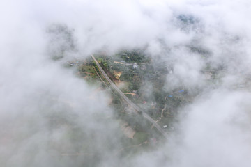 Aerial View of Village landscape and River over Clouds in Chiangdao Thailand
