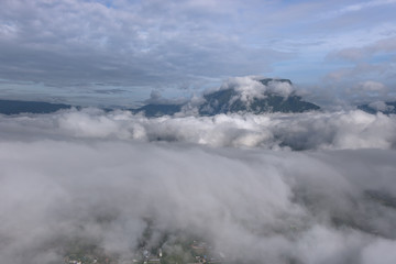 Aerial View of Village landscape and River over Clouds in Chiangdao Thailand
