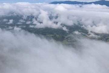 Aerial View of Village landscape and River over Clouds in Chiangdao Thailand
