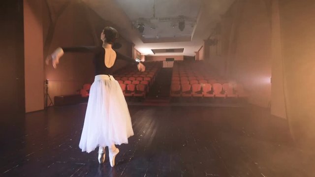 The ballerina dancing in the theatre. Close-up. Dolly. HD.