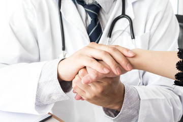 Doctor reassuring her female patient