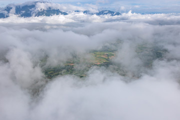 Aerial View of Village landscape and River over Clouds in Chiangdao Thailand
