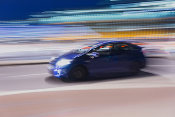 Fototapeta na wymiar Speeding car at night