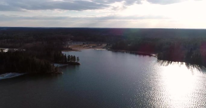 Oittaa, Cinema 4k aerial flight towards Oittaa beach, at bodom lake, on a sunny spring day, in Espoo, Finland
