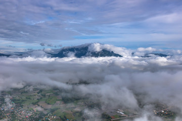 Aerial View of Village landscape and River over Clouds in Chiangdao Thailand
