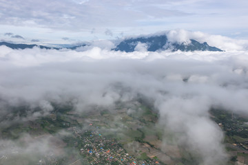 Aerial View of Village landscape and River over Clouds in Chiangdao Thailand
