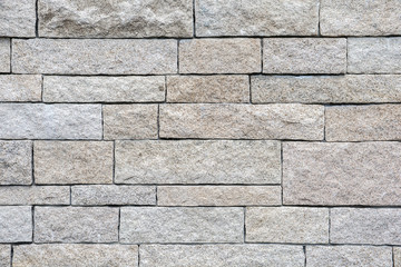 Yellow white sandstone bricks wall background and texture.