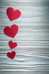 Set of red paper hearts on wooden board Valentine cards