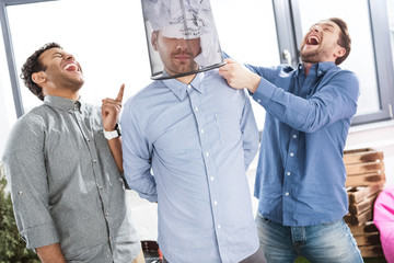 portrait of young business team having fun in office, business teamwork