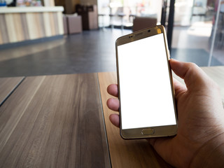 Man hand holding touch screen smart phone with white blank empty screen (ISOLATED), blurred fast food restaurant for background.