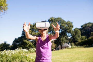 Girl using vr headset in the park
