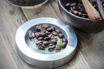 coffee beans over wooden background on Food and Drink theme with selected focus