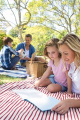 Mother and daughter reading book 