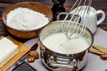 bechamel sauce in a pan and ingredients