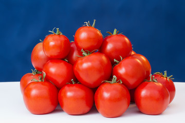  Red ripe tomatoes on a table