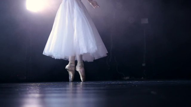 Ballerina's legs in pointe shoes. No face. Close-up. HD.