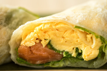 breakfast burrito with cheese, eggs and heirloom cherry tomato, salmon