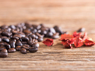 black roasted coffee beans on aged wood