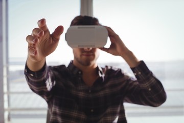 Businessman using virtual reality headset 