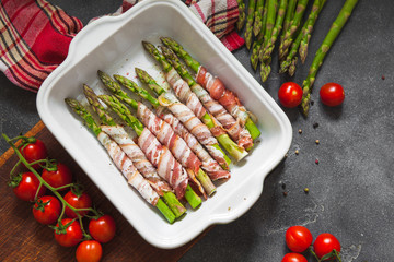 Baked green asparagus wrapped with bacon