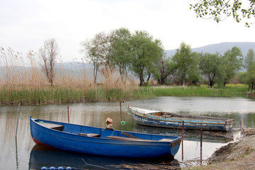tourist and fisherman boats on lake ohrid in macedonia,