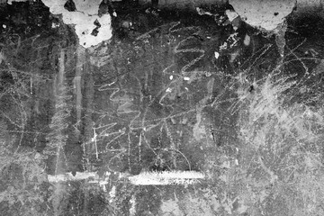 Wall fragment with scratches and cracks
