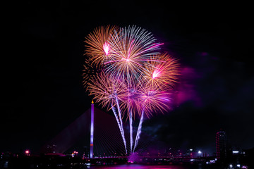 Beautiful colorful firework display for celebration happy new year and merry christmas in the night sky, bangkok city, thailand