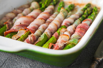 Baked green asparagus wrapped with bacon