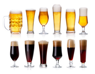 set of mugs and glasses with light and dark beer isolated on white