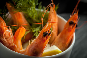 Shrimp in the cup on stone plate.