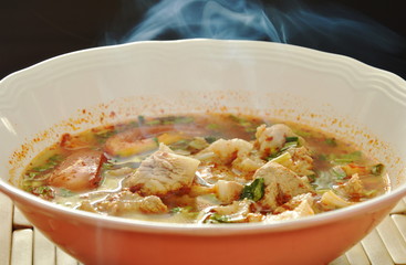 smoke on hot and spicy pork bone with tamarind and Thai herbs soup 