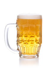 Frosty mug of light beer with foam on white.