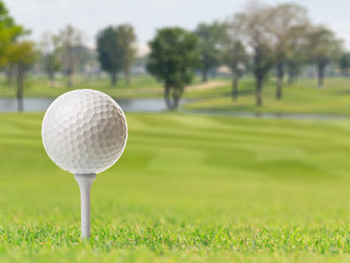 Golf ball on tee in golf course
