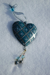 Vintage blue heart in the snow