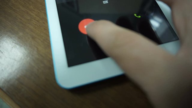 Decline an incoming call on smart phone close-up
